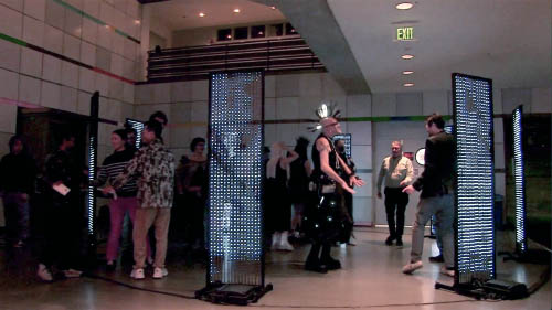 8 handmade LED video panels in a circle with people dancing amongst them